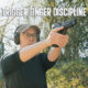 trigger discipline hero image showing the author holding a pistol with proper trigger discipline