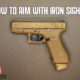 a glock pistol for how to aim with iron sights hero image