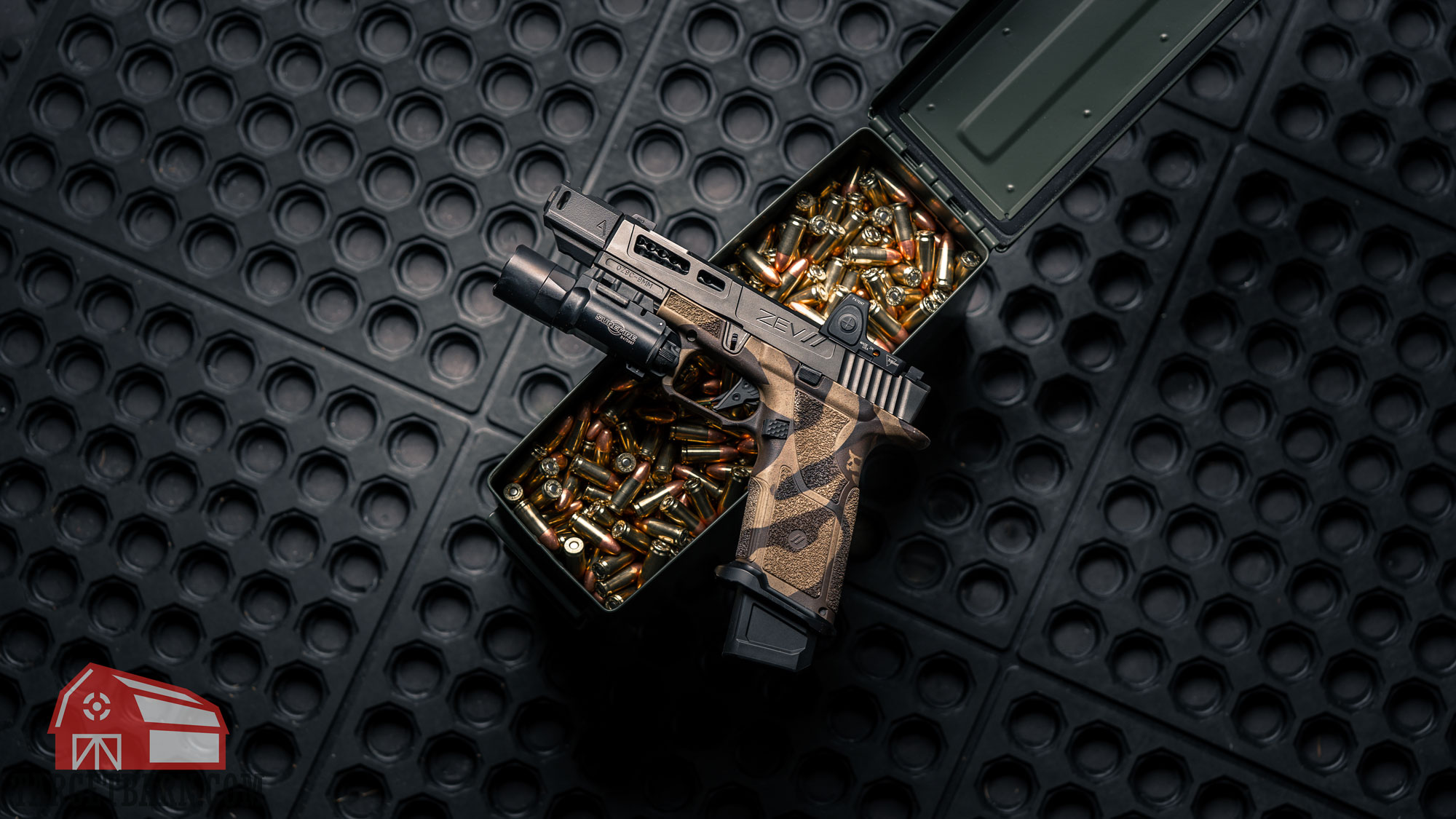 a zev pistol with a compensator sitting on an open can filled with 9mm ammo